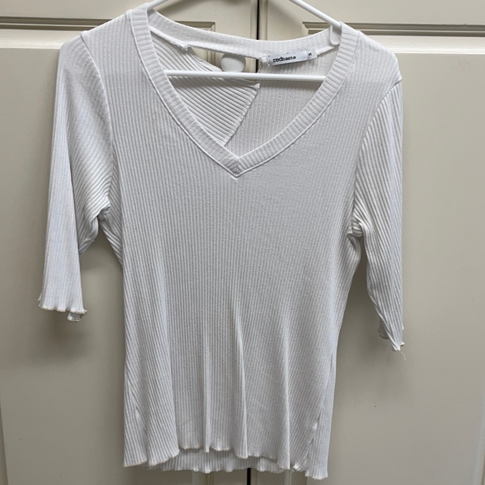 White top with cut out back detail.